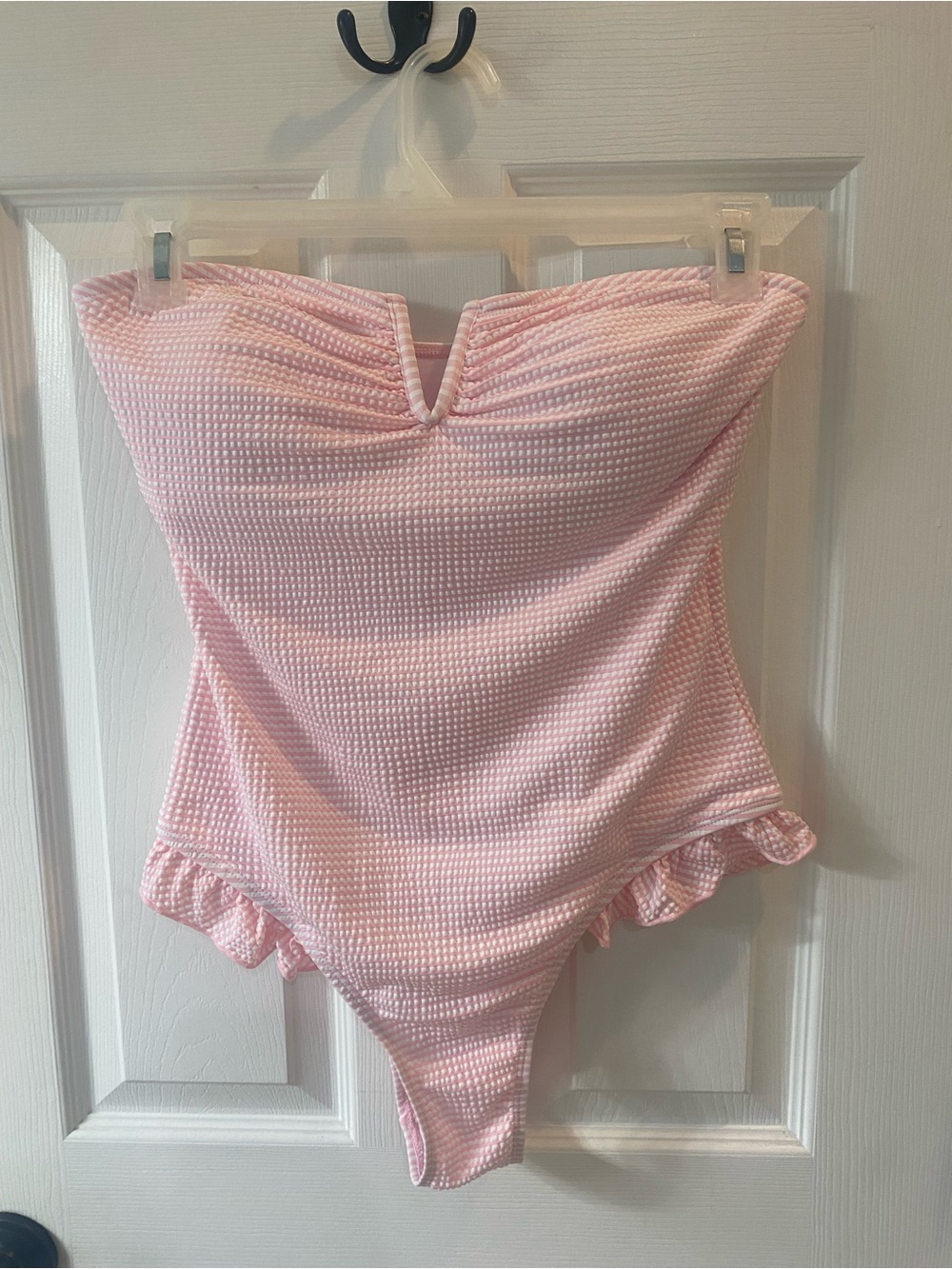 Boutique pink gingham one piece bathing suit with ruffled trim.